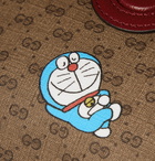 GUCCI - Doraemon Leather-Trimmed Printed Monogrammed Coated-Canvas Belt Bag - Brown