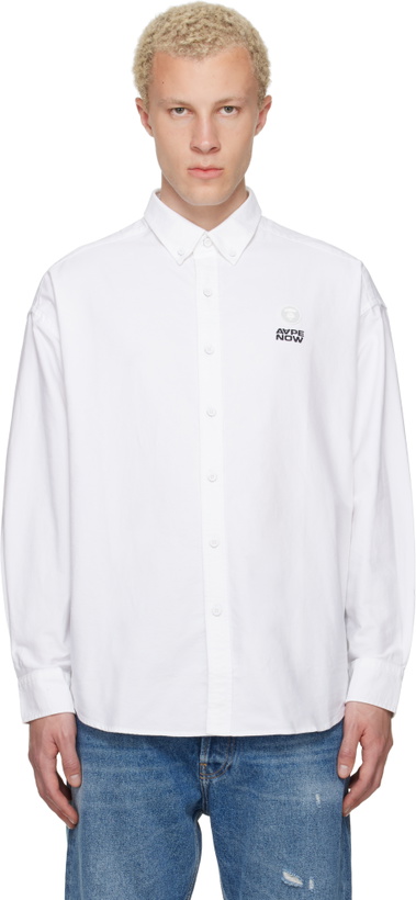 Photo: AAPE by A Bathing Ape White 'AAPENOW' Moonface Logo Long Sleeve Shirt