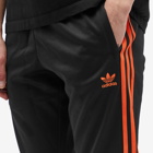 Adidas Men's Superstar Track Pant in Black/Orange