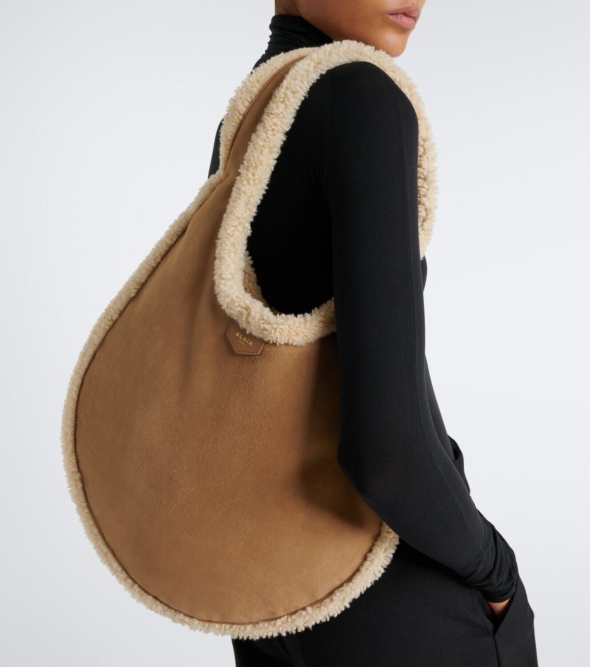 Alaïa One Piece shearling-lined suede shoulder bag