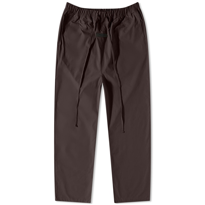 Photo: Fear of God ESSENTIALS Men's Woven Relaxed Trouser in Plum