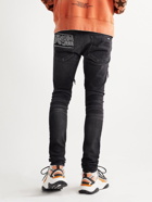 AMIRI - Skinny-Fit Appliquéd Panelled Distressed Jeans - Black