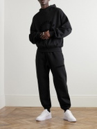 FEAR OF GOD ESSENTIALS - Straight-Leg Logo-Flocked Cotton-Blend Jersey Sweatpants - Black