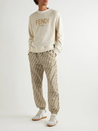 Fendi - Tapered Logo-Print Shell Drawstring Trousers - Neutrals