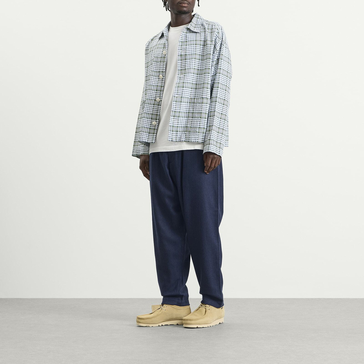 Universal Works Men's Wool Herringbone Pleated Track Pant in Navy