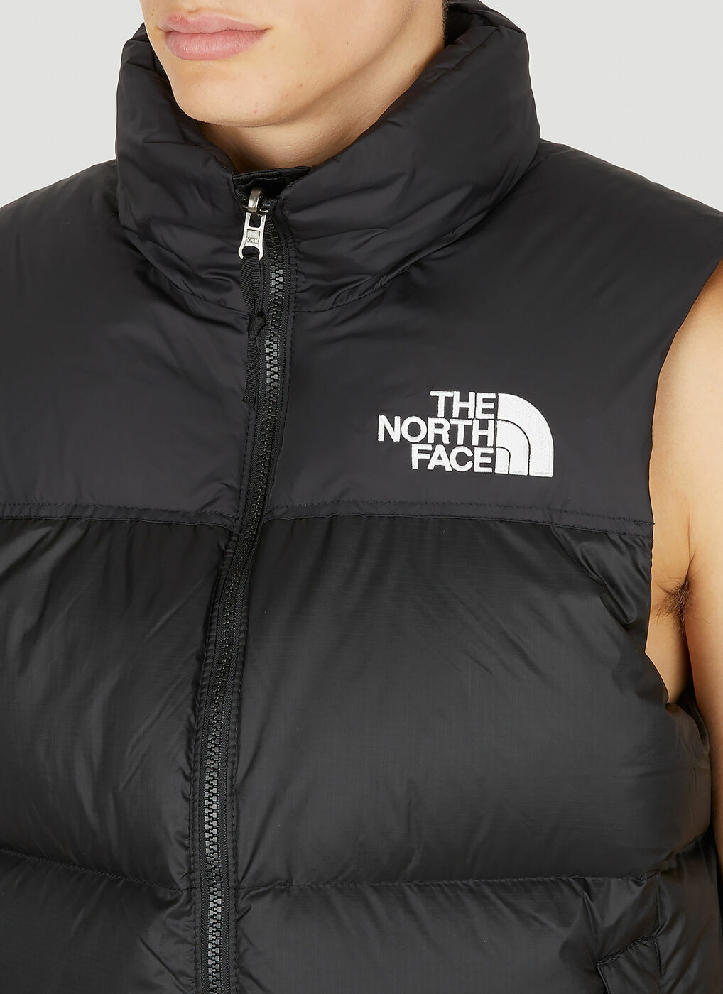 1966 Retro Nuptse Sleeveless Jacket in Black The North Face