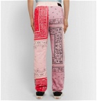 AMIRI - Tapered Bandana-Print Cotton-Jersey Drawstring Sweatpants - Pink
