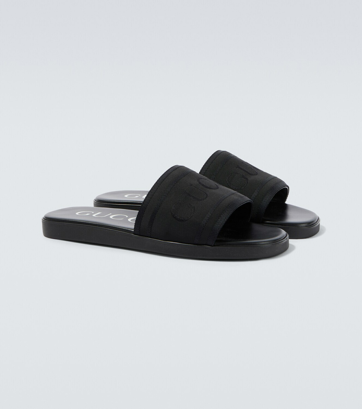 Gucci Logo canvas and leather slides
