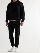 FRAME - Tapered Logo-Print Fleece-Back Cotton-Blend Jersey Sweatpants - Black