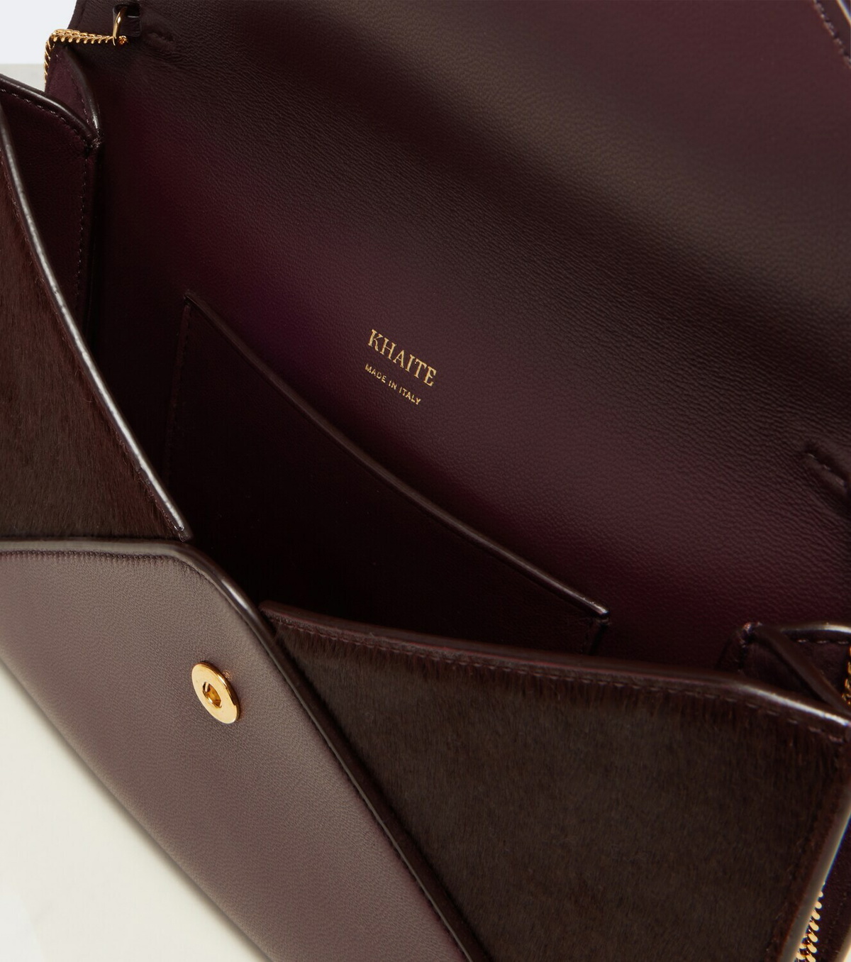 Khaite Grace leather-trimmed suede clutch