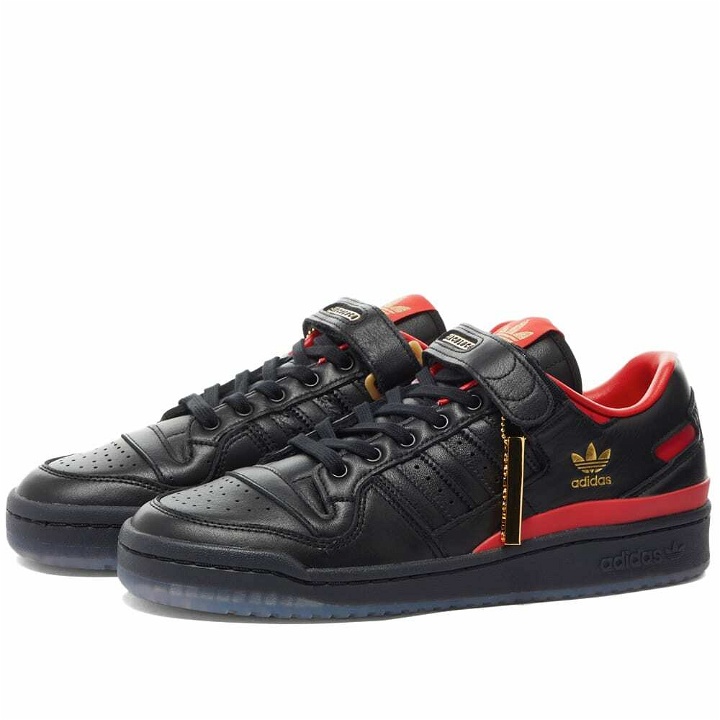 Photo: Adidas x Circoloco Forum Low Sneakers in Core Black/Vivid Red