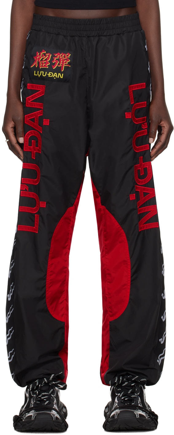 Photo: LU'U DAN Black & Red Shell Track Pants