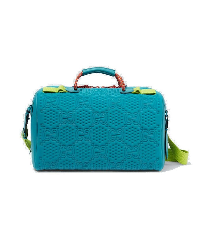 Photo: Gucci Embossed GG leather-trimmed duffel bag