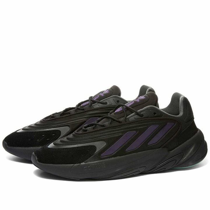 Photo: Adidas Ozelia Sneakers in Core Black/Collegiate Purple/Screaming Green