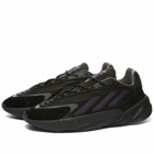 Adidas Ozelia Sneakers in Core Black/Collegiate Purple/Screaming Green