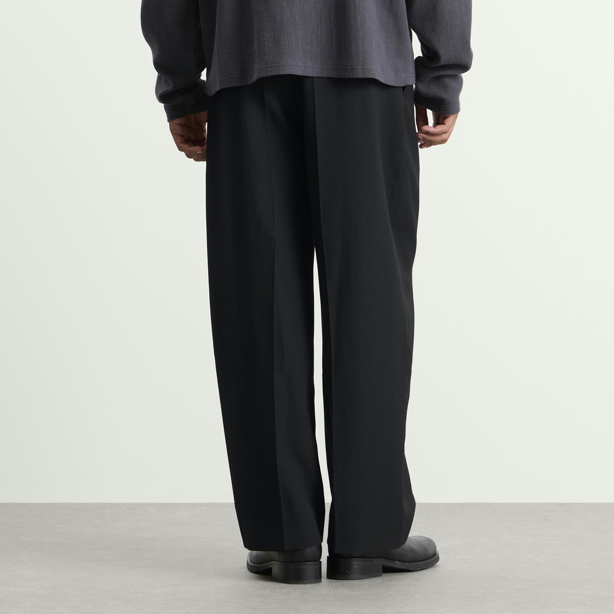 Studio Nicholson Men's Line Tech Wool Pleated Trouser in Black