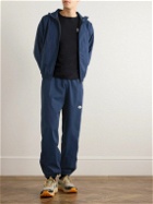 DISTRICT VISION - Logo-Appliquéd Tapered Nylon Trousers - Blue