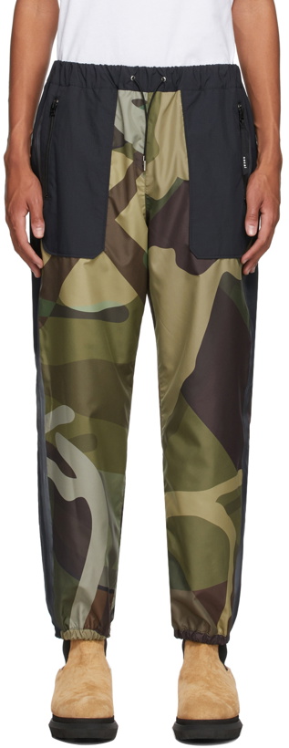 Photo: Sacai Green & Black KAWS Edition Camo Lounge Pants