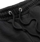 Heron Preston - Tapered Printed Organic Loopback Cotton-Jersey Drawstring Track Pants - Black