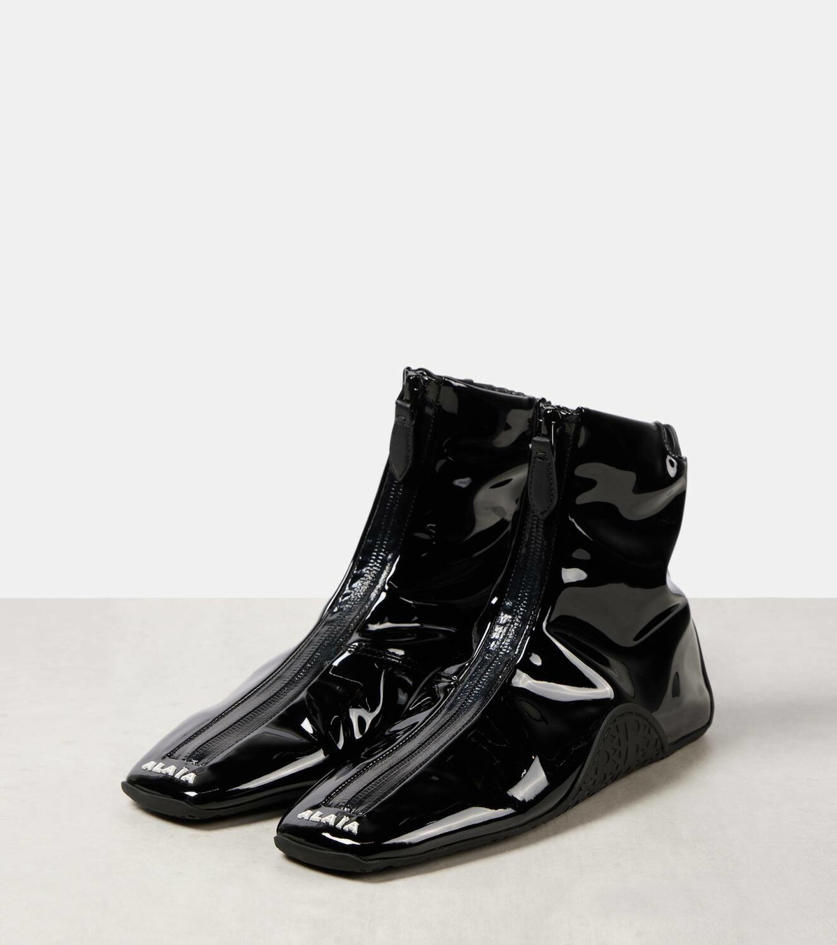Alaïa Sneaker faux patent leather ankle boots