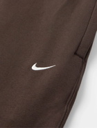 Nike - Solo Swoosh Tapered Logo-Embroidered Cotton-Blend Jersey Sweatpants - Brown