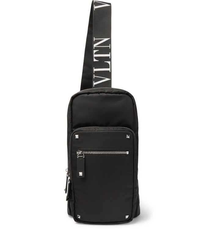 Photo: Valentino - Valentino Garavani Leather-Trimmed Shell Sling Backpack - Black