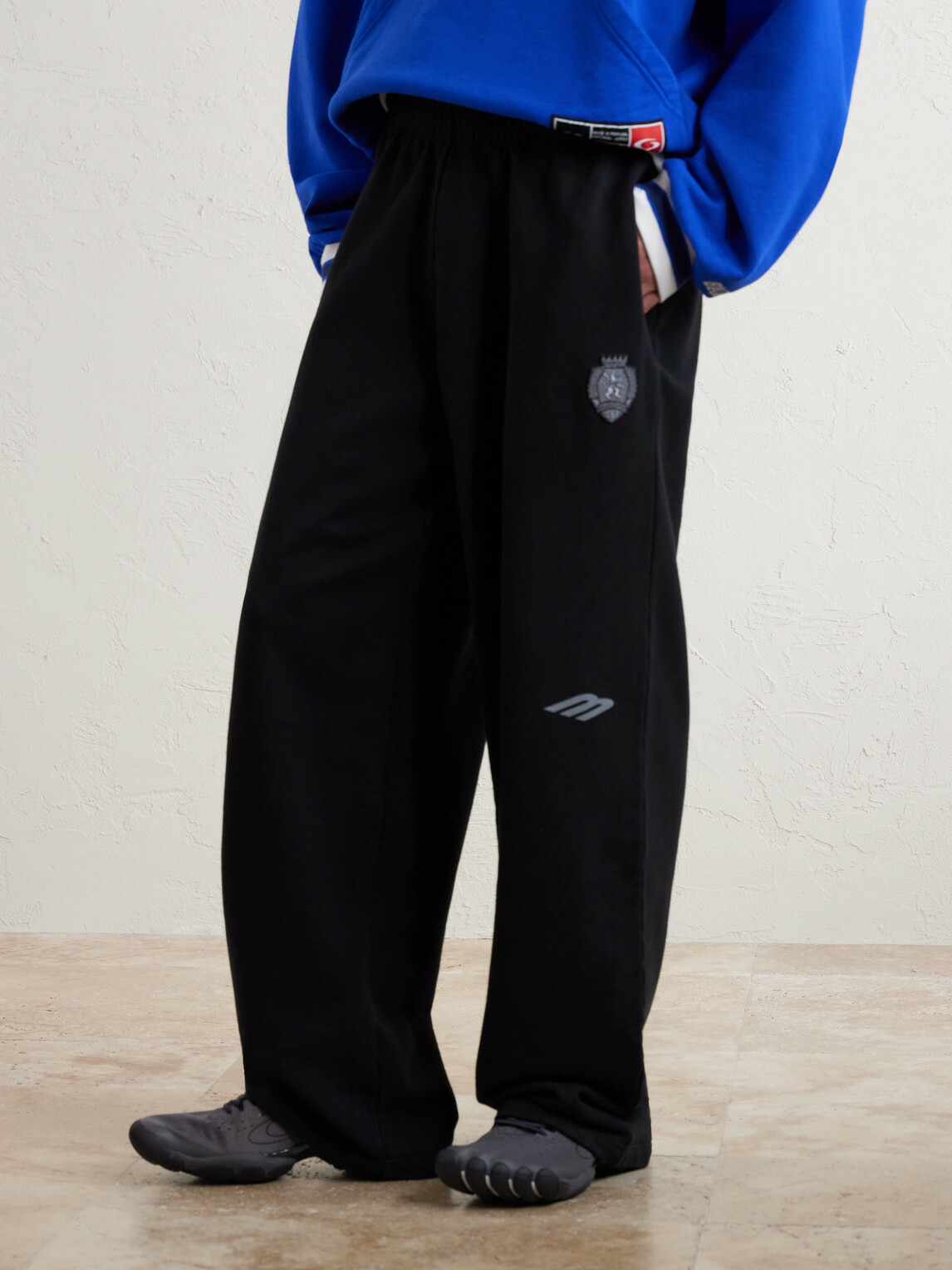 Balenciaga - Wide-Leg Logo-Print Appliquéd Cotton-Jersey Sweatpants - Black