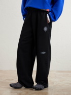 Balenciaga - Wide-Leg Logo-Print Appliquéd Cotton-Jersey Sweatpants - Black