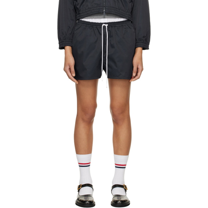 Photo: Thom Browne Navy Nylon Tech Track Shorts