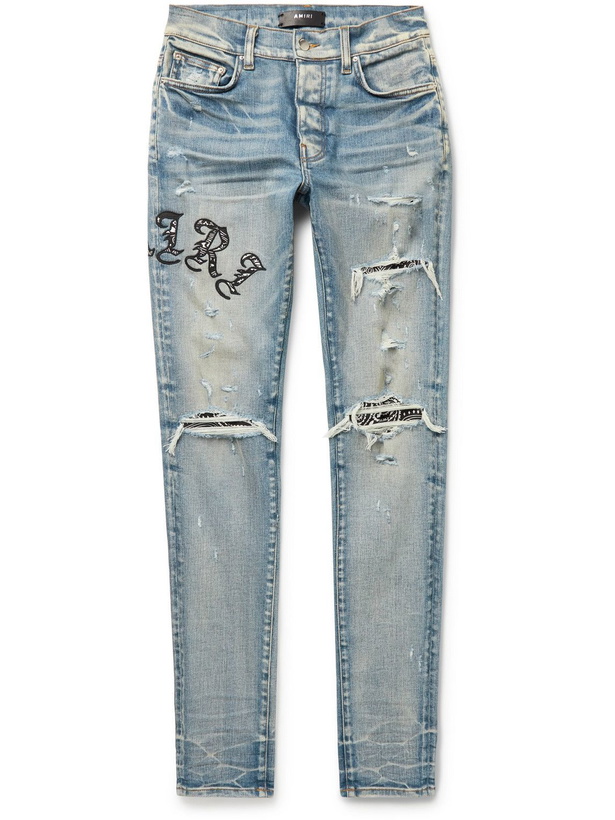 Photo: AMIRI - Skinny-Fit Appliquéd Panelled Distressed Jeans - Blue