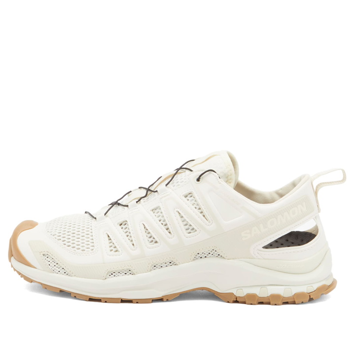 Photo: Salomon Men's Xa Pro 3D Amphib Sneaker in Vanilla Ice/Almond Milk/Curry