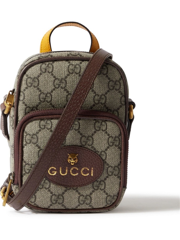 Photo: GUCCI - Leather-Trimmed Monogrammed Coated-Canvas Messenger Bag