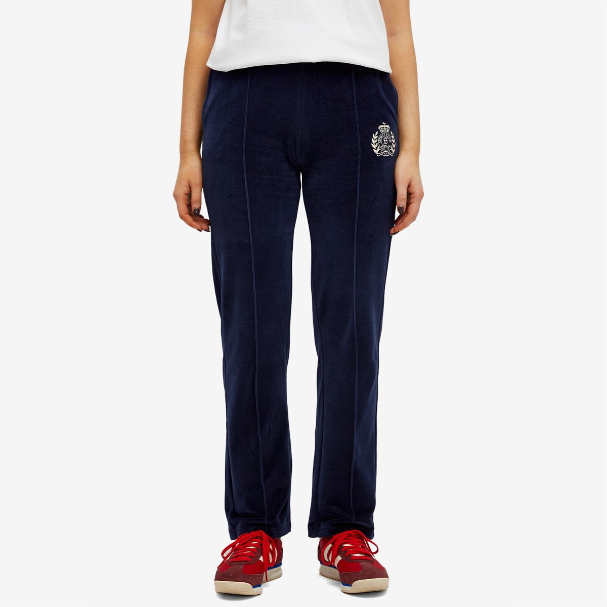 Sporty & Rich Women's NY Crest Velour Track Pants in Navy Cream