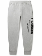 Alexander McQueen - Tapered Logo-Print Mélange Loopback Cotton-Jersey Sweatpants - Gray