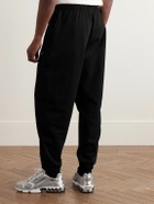 Nike - Solo Swoosh Tapered Logo-Embroidered Cotton-Blend Jersey Sweatpants - Black