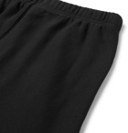 Heron Preston - Tapered Printed Loopback Cotton-Jersey Sweatpants - Black