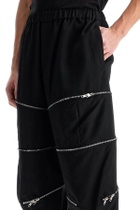 COMME DES GARCONS BLACK cropped pants with zip openings. Black