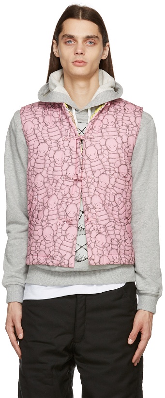 Photo: Comme des Garçons Shirt Pink & Black Kaws Edition Padded Vest