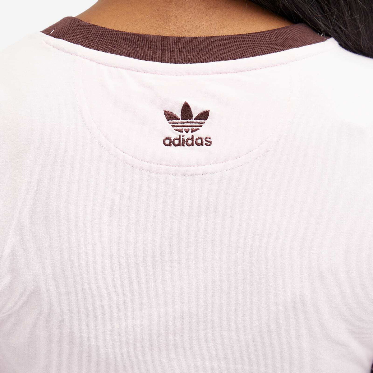 white adidas shirt with pink logo