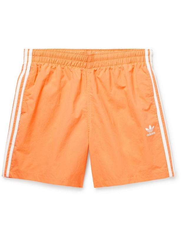 Photo: ADIDAS ORIGINALS - Adicolor Classics Striped Primegreen Swim Shorts - Orange