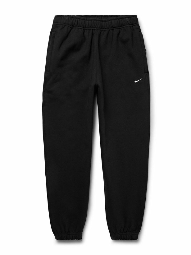 Photo: Nike - Solo Swoosh Tapered Logo-Embroidered Cotton-Blend Jersey Sweatpants - Black