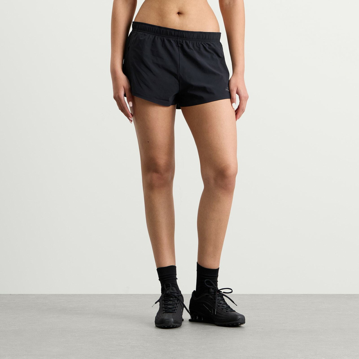 Nike Women's x SKIMS Stretch Nylon Runner Short in Obsidian
