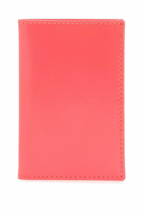 Photo: COMME DES GARCONS WALLET portafoglio compatto unisex rosa fluo in pelle di capra Pink