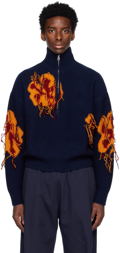 Photo: WYNN HAMLYN Orange & Navy Reverse Intarsia Sweater