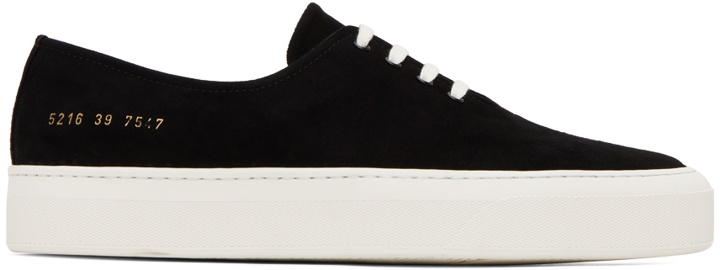 Photo: Common Projects Black Four Hole Sneakers