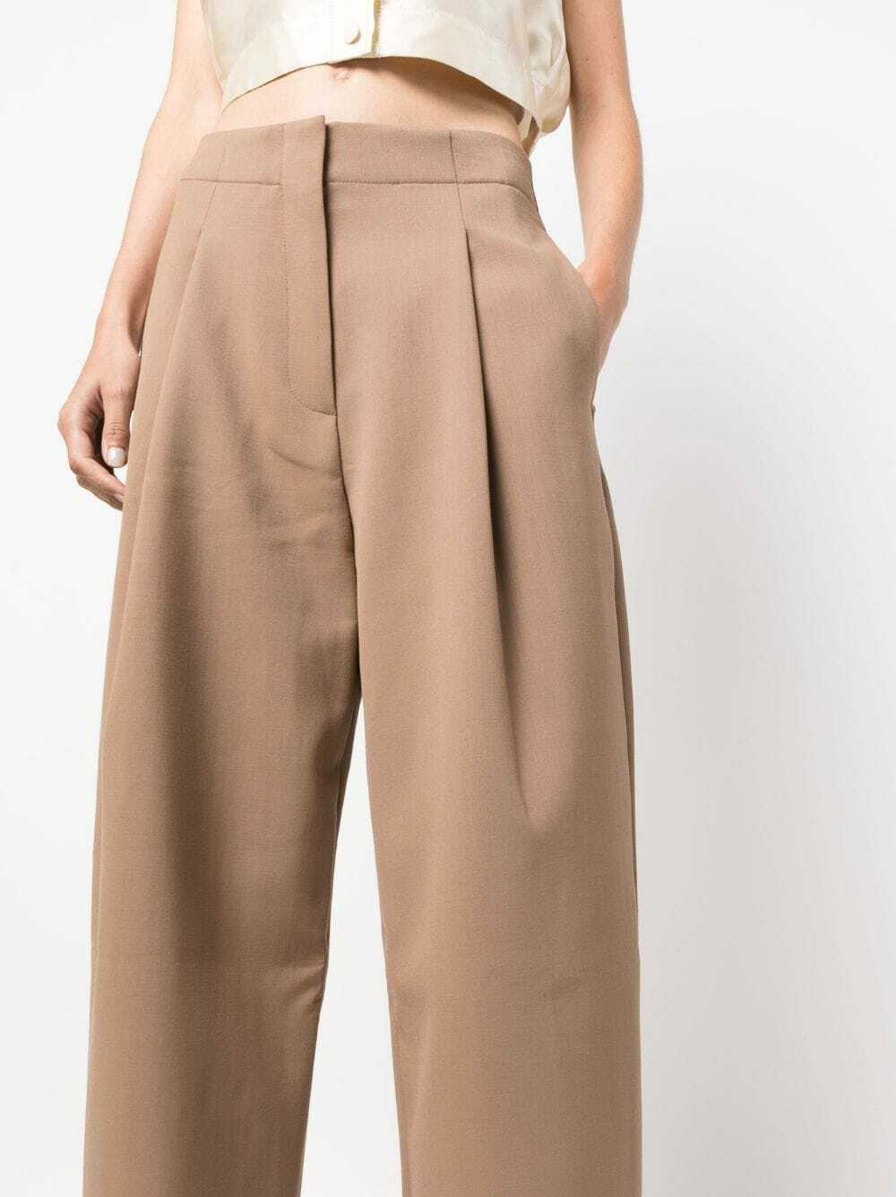 Studio Nicholson cropped wool navy Tuck trousers main image 0