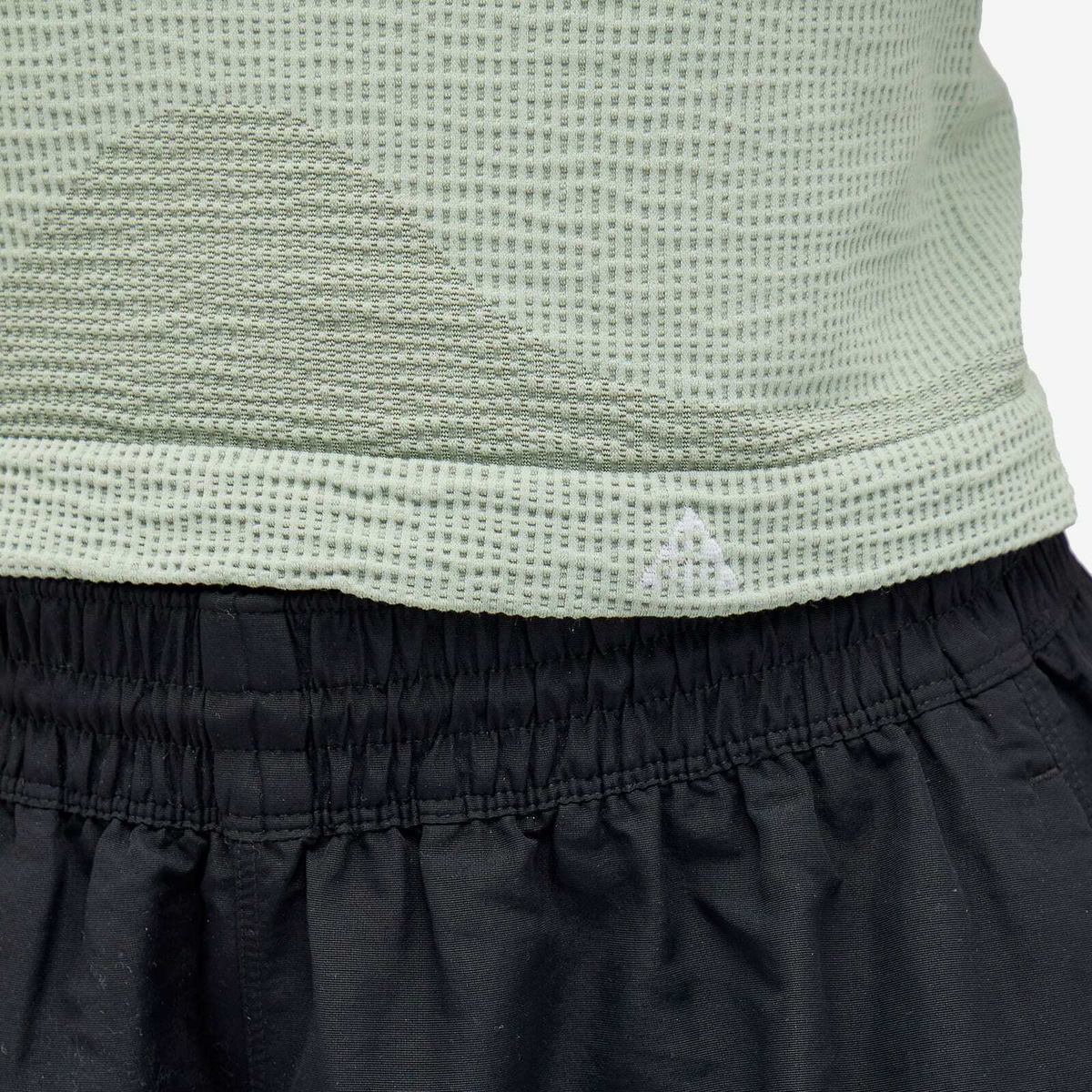 Nike Women's ACG DLTA BSLR Tank Top in Jade Horizon/Guava Ice
