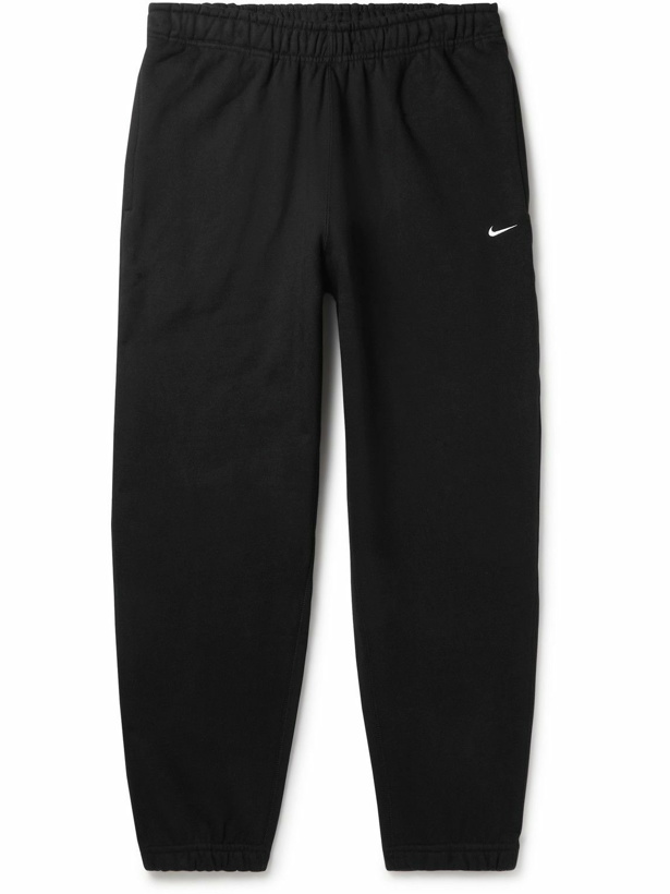 Photo: Nike - NRG Tapered Logo-Embroidered Fleece-Back Cotton-Jersey Sweatpants - Black