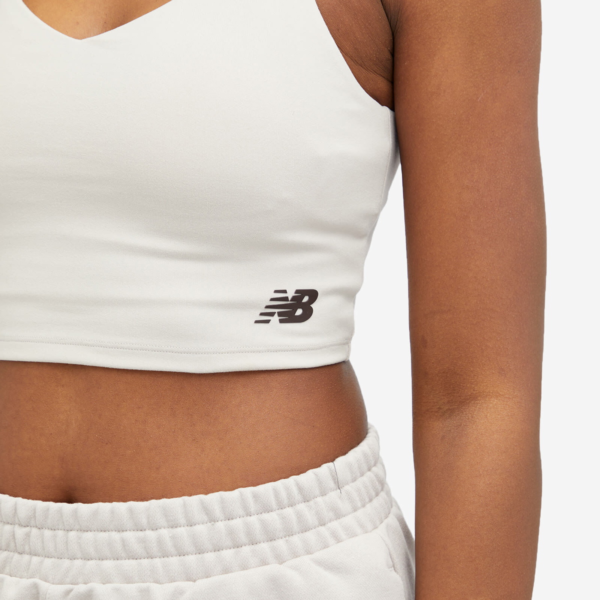 New Balance Women's Linear Heritage Soft Bra Top in Moonrock