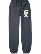 SAINT MXXXXXX - Tapered Logo-Print Cotton-Blend Jersey Sweatpants - Blue